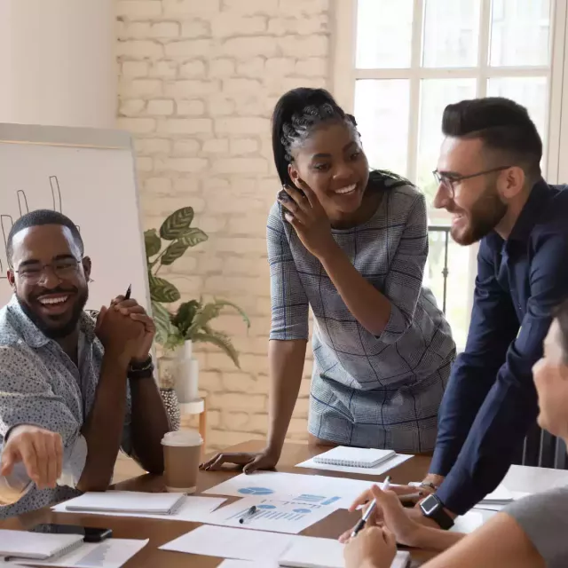 Business people smiling and working together. 