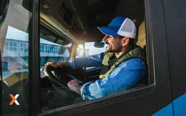 man driving truck smiling