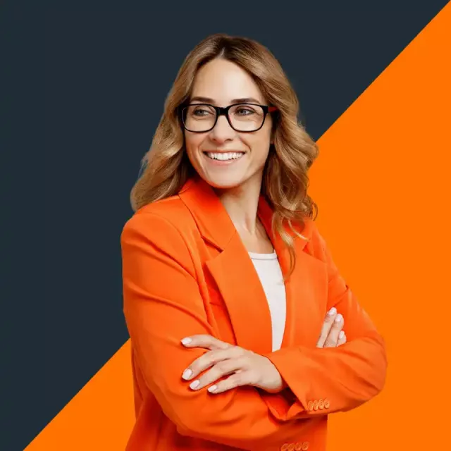 woman standing in an orange blazer